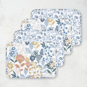 table placemats with a mixture of floral, geometric, and retro botanical prints, in a refreshing color palette