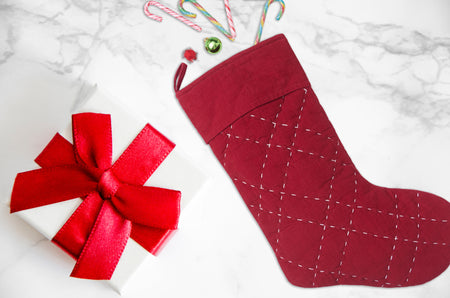 Elliot Ruby Quilted stocking in festive red.