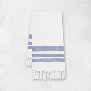 woven kitchen towel with blue stripes on a white background