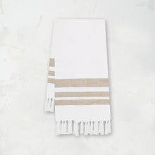 woven kitchen towel with light brown stripes on a white background