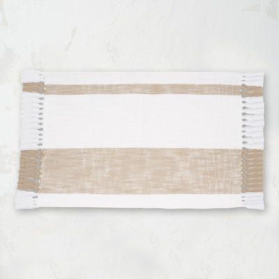 woven cotton placemat with light brown stripes and fringed edges