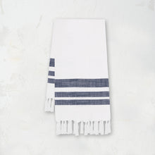 woven kitchen towel with dark blue stripes on a white background