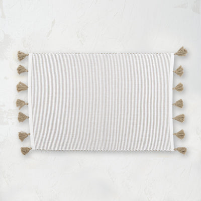 handwoven dune beige and white striped placemat with tassels